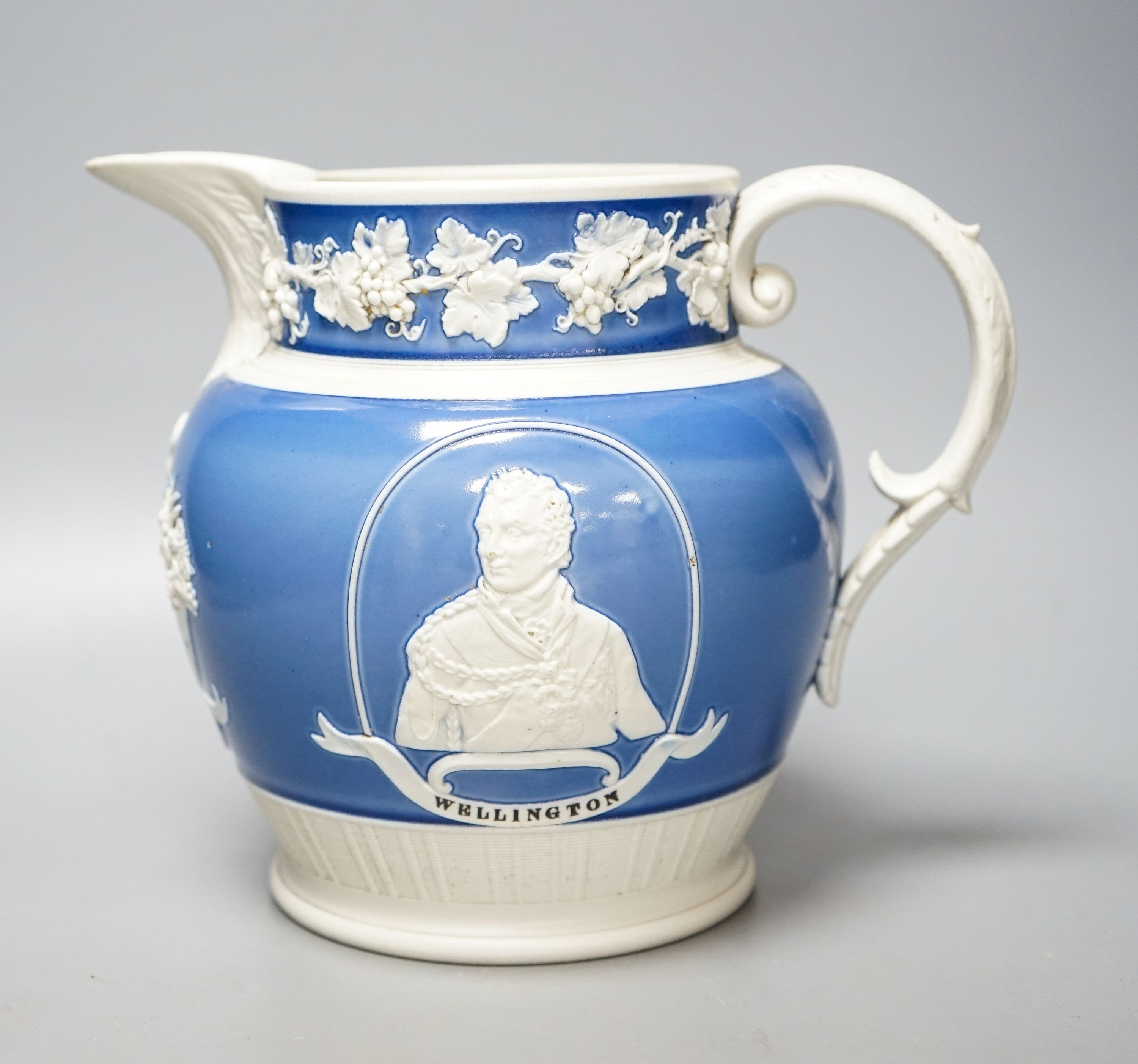 An early 19th century Wellington & Blucher commemorative peace & plenty jasper ware style jug 19cm